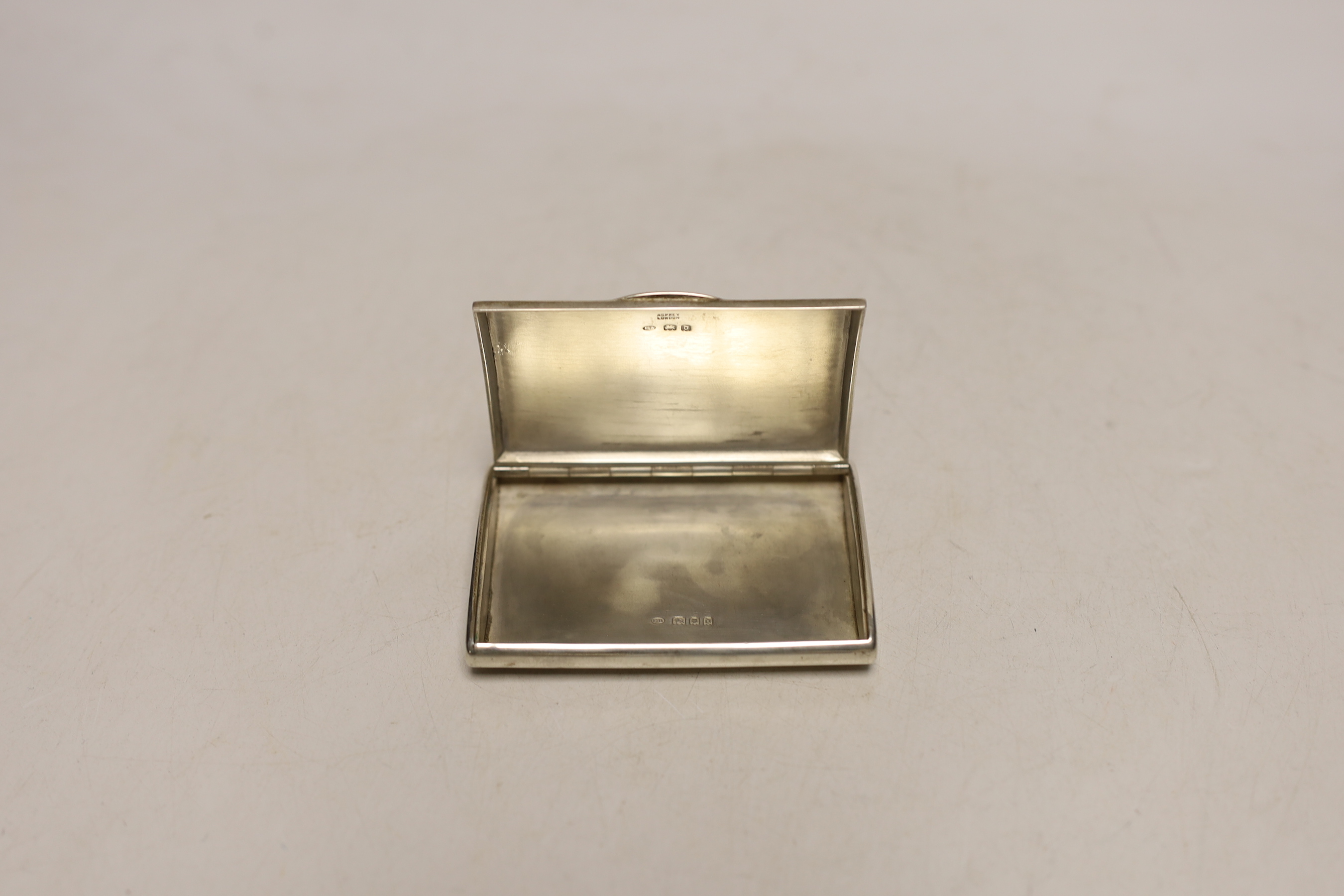 A George V silver cigarette case, Frederick Thomas Buckthorpe, London 1919, retailed by Asprey & Co, 8.5cm.